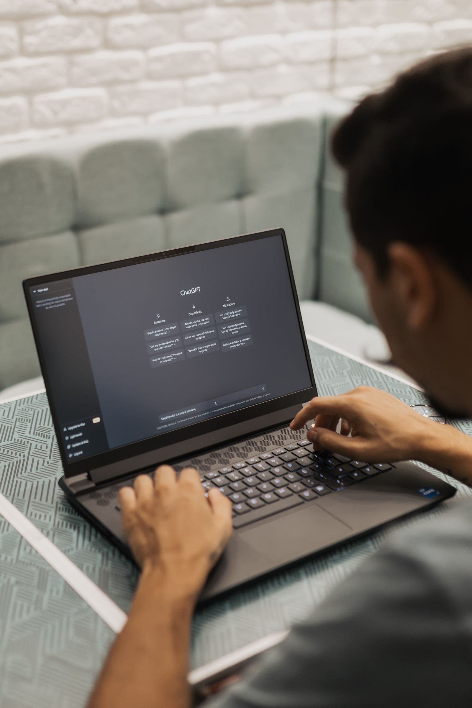 Person using an AI chatbot on a laptop to research PPF installers in Florida
