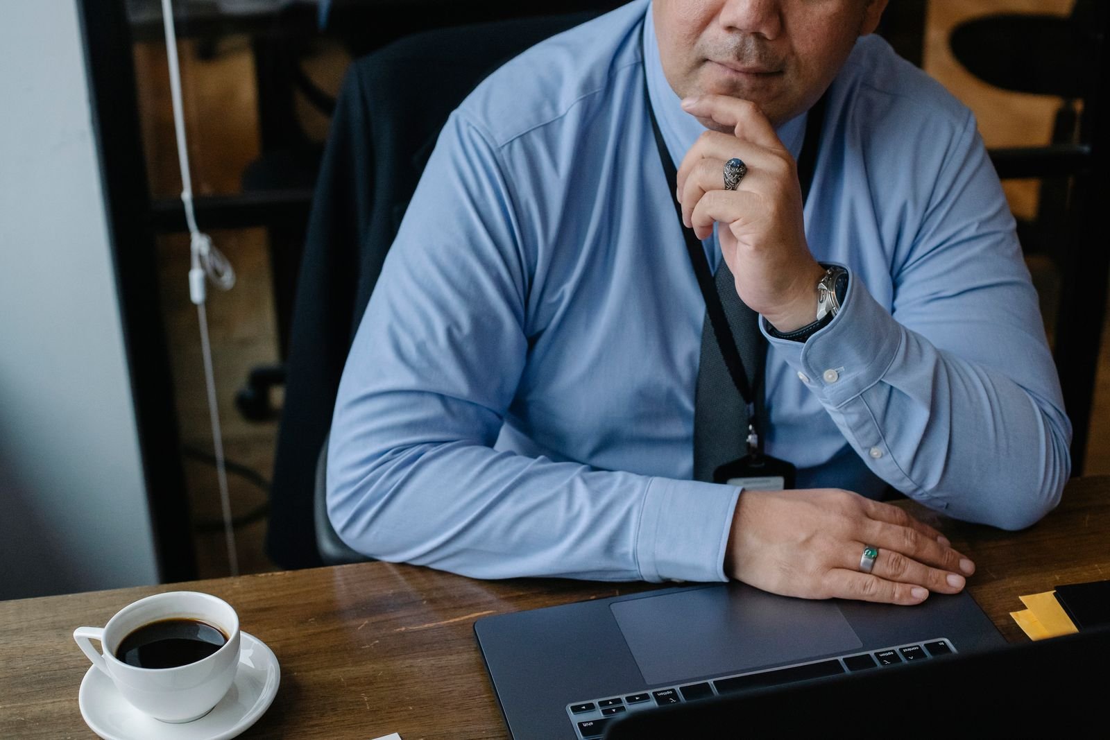 Auto shop owner in Florida reviewing website content and schema markup on a laptop