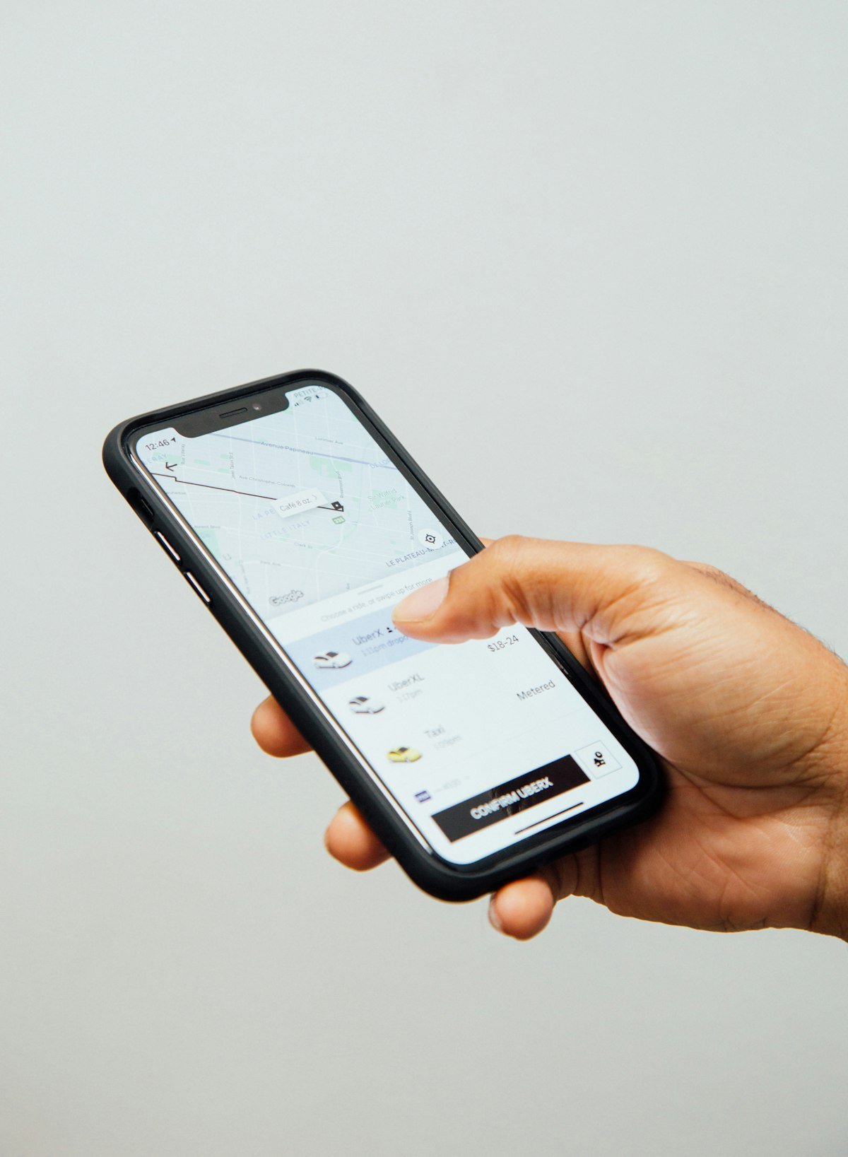 Online booking system for detailing shops shown on a phone
