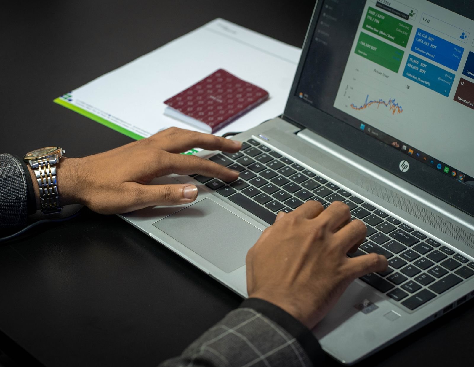 Marketer analyzing ad campaign performance data on a laptop screen