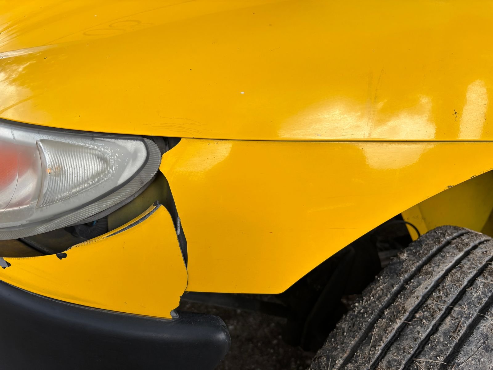 Close-up of a damaged car bumper after a collision in Florida