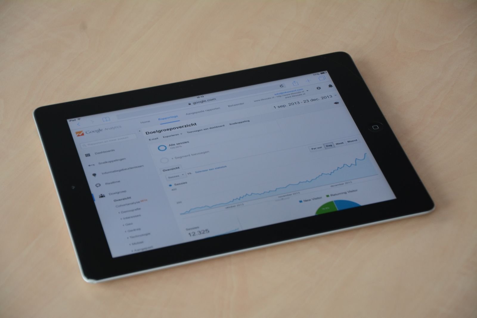Shop owner reviewing a lapsed customer list on a tablet to trigger a win-back campaign