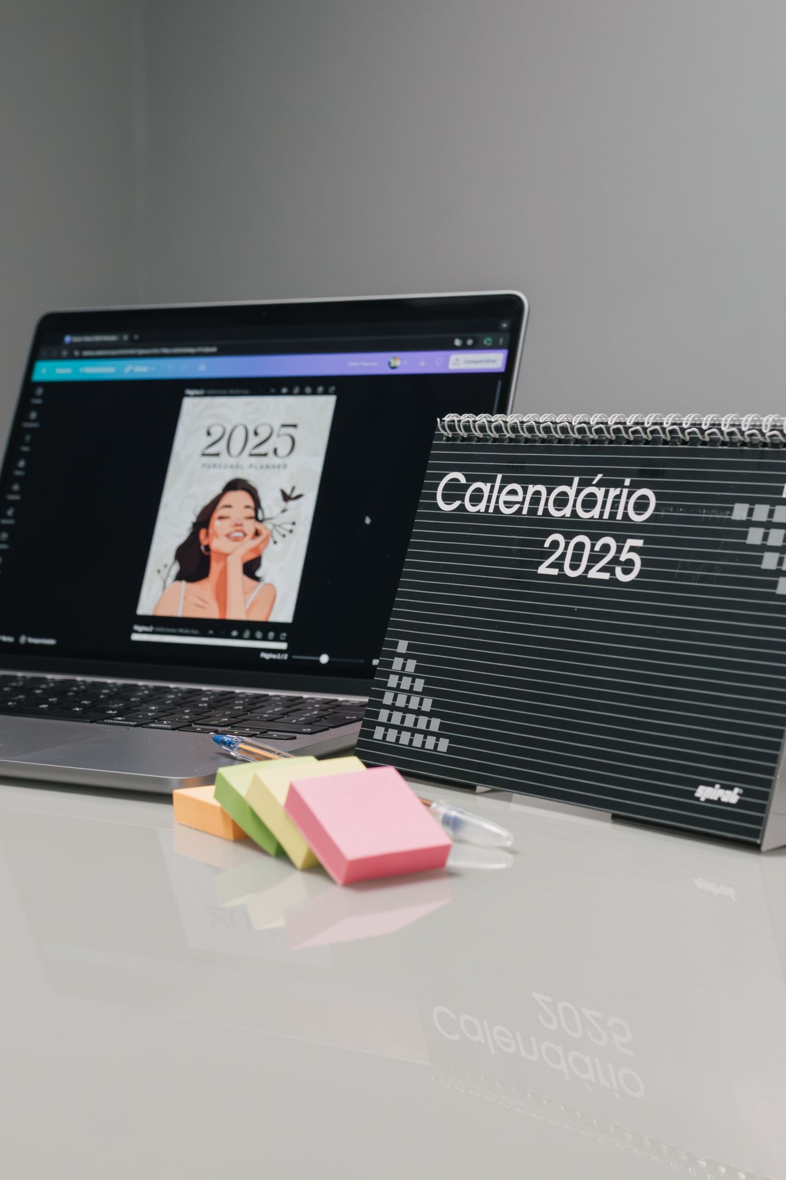 Desk calendar and laptop used to plan an SEO timeline for a detailing shop