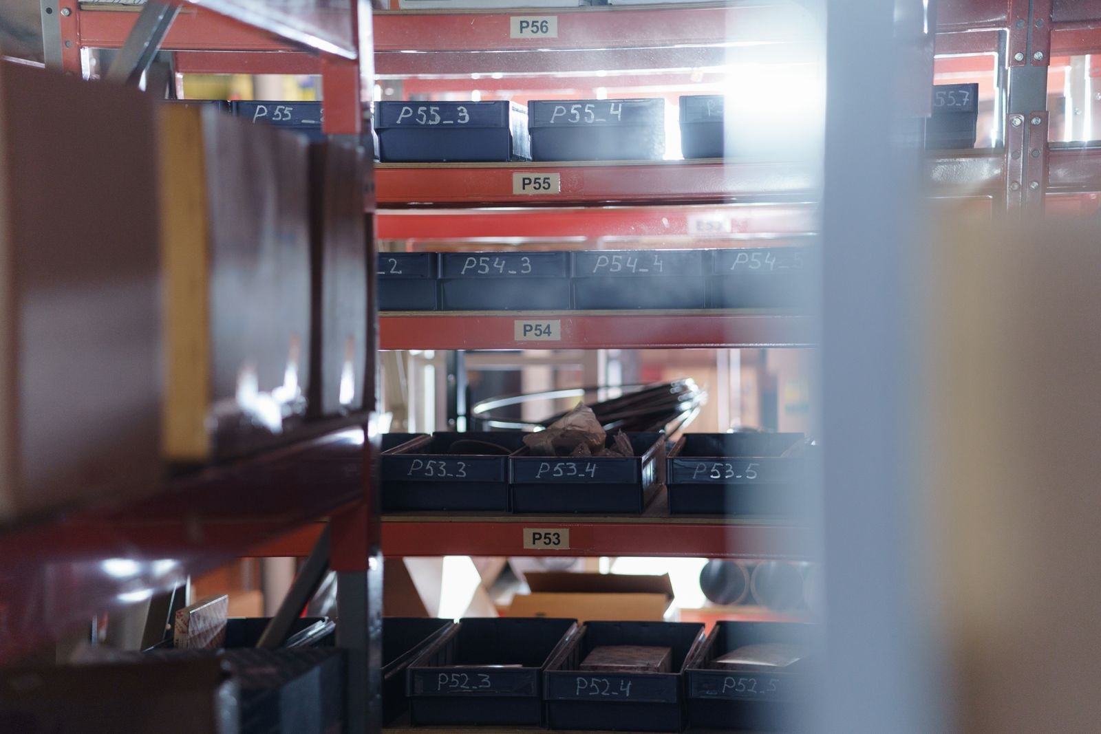 Labeled auto parts shelves in a Florida fulfillment warehouse