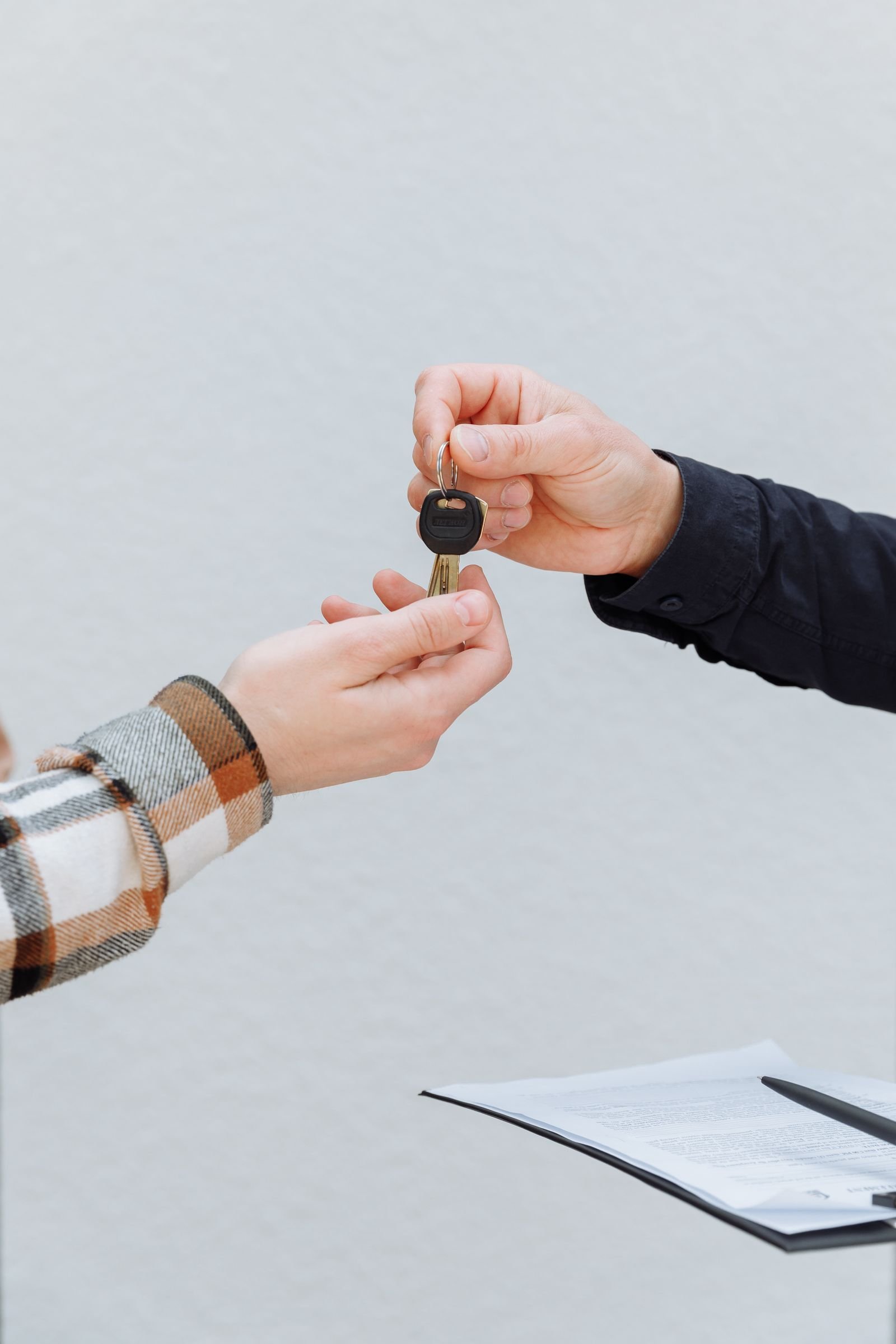 Rental staff handing over keys for an exotic car rental in Florida