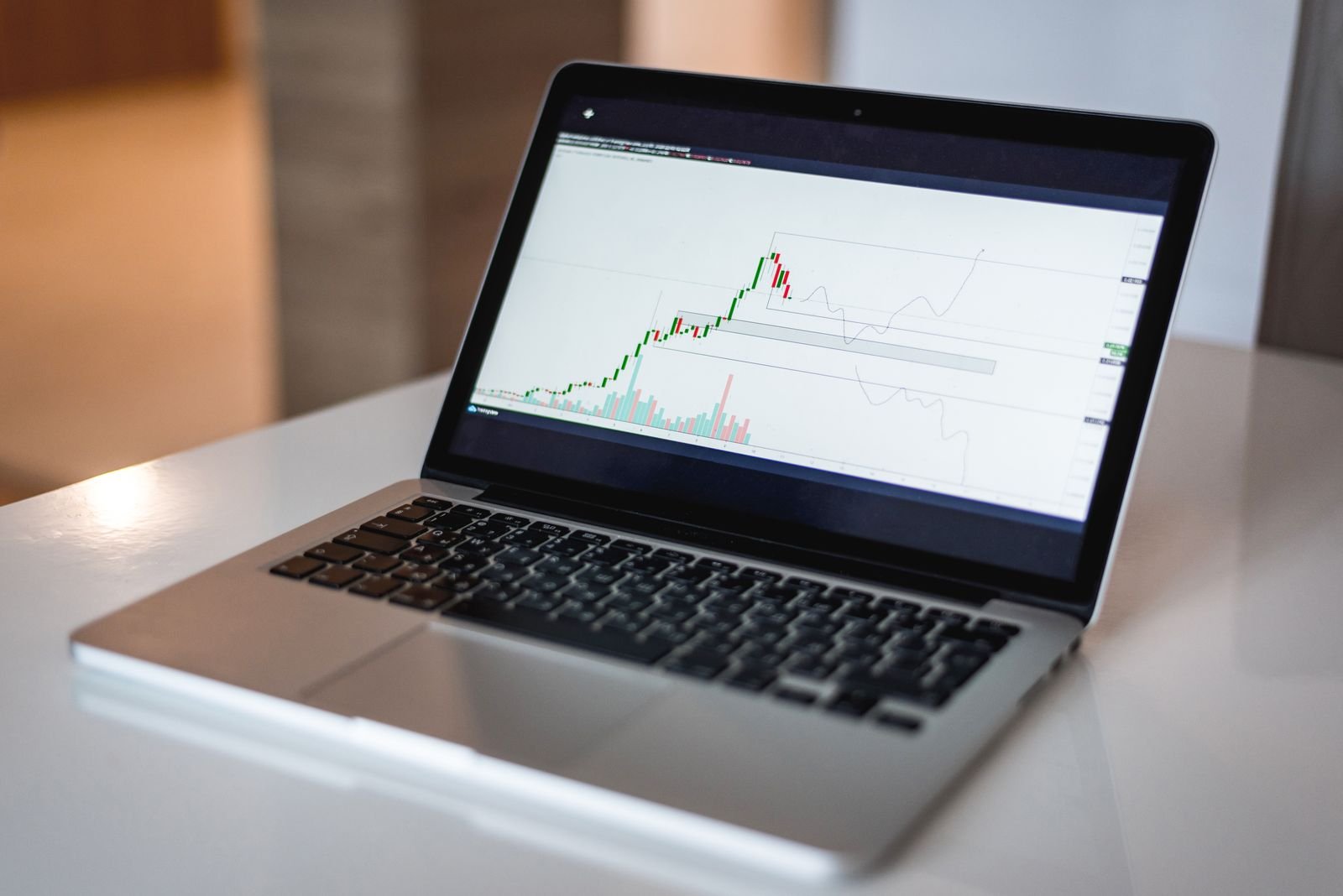 Marketer tracking Google Ads campaign performance on a laptop