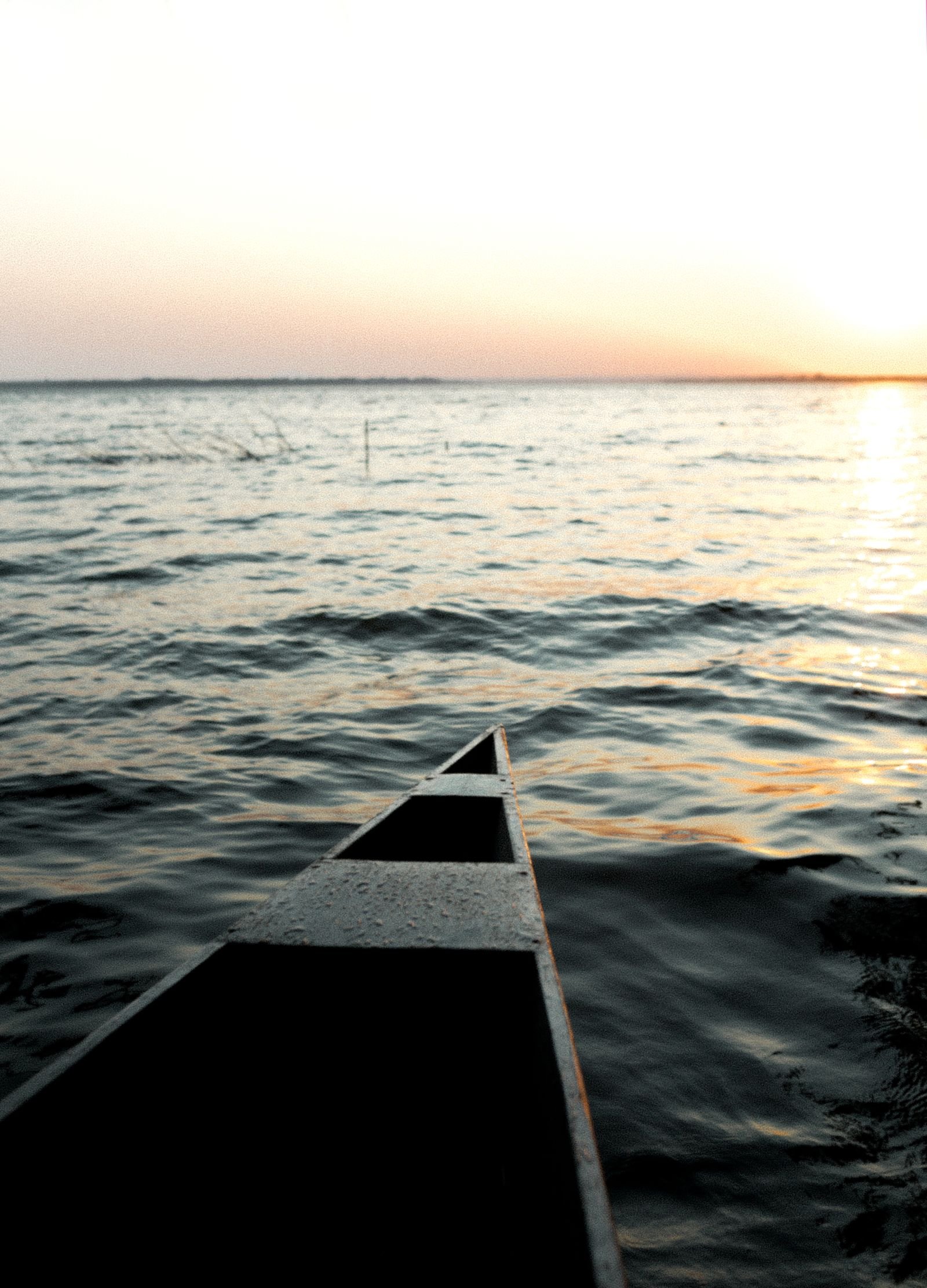 Boat on calm water during a Florida off-season sunset