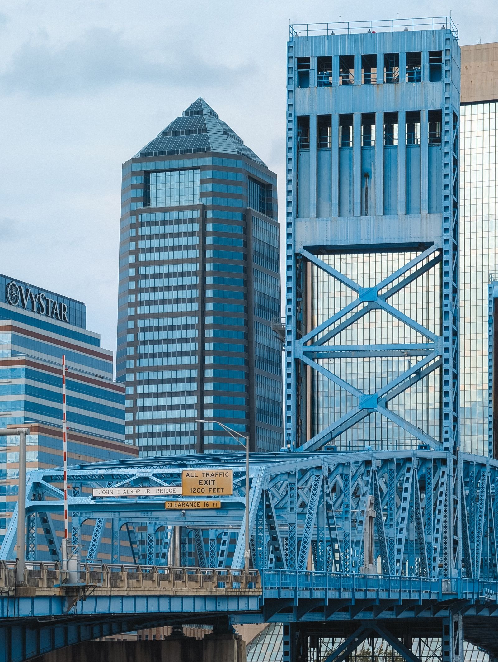 Downtown Jacksonville Florida skyline and bridge near auto body repair shops