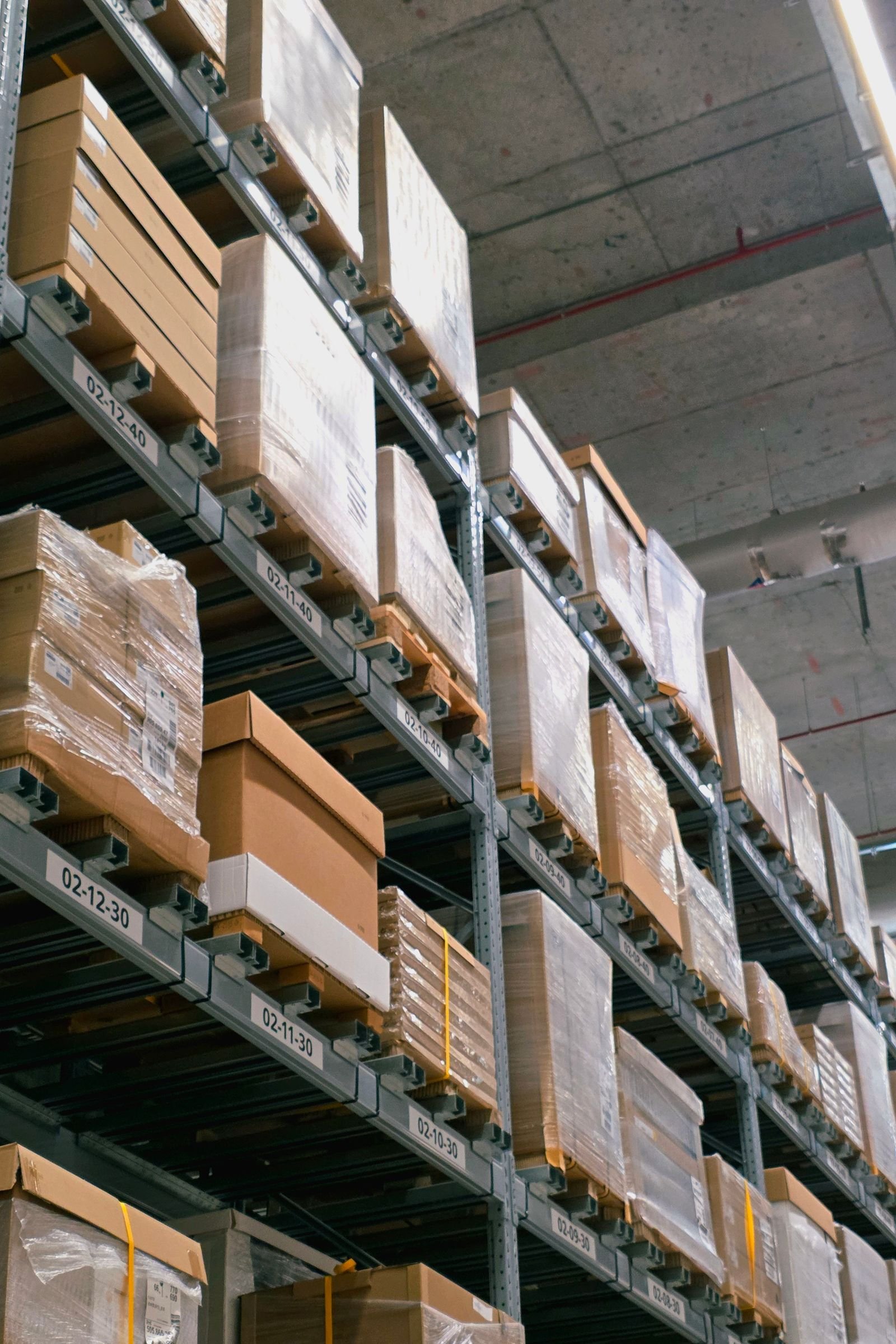 Warehouse storage with stacked cardboard boxes ready for shipping auto parts orders in Florida