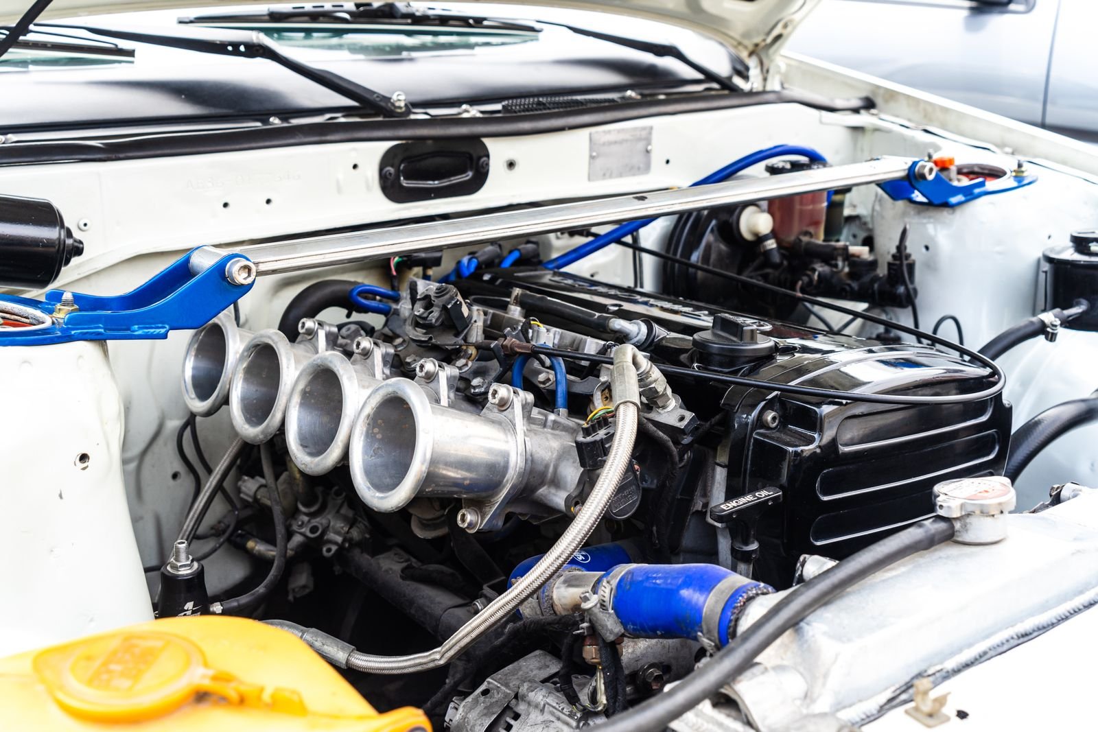 Close-up of a modified car engine and parts, the kind of build featured by Jacksonville performance shops